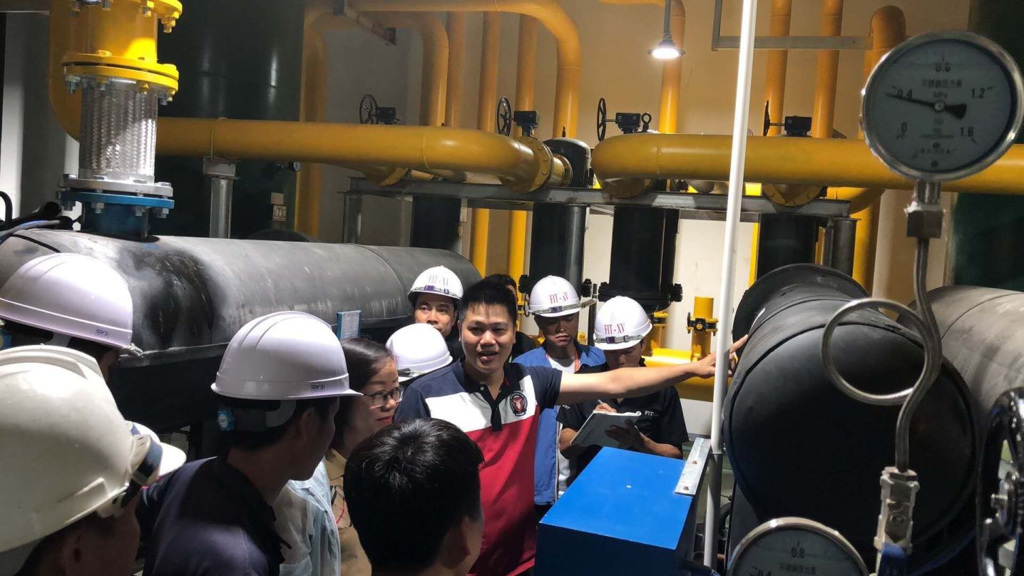 Engineer performing quality inspection in factory